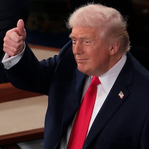 U.S. President Donald Trump gives a thumbs up as he delivers his State of the Union address.