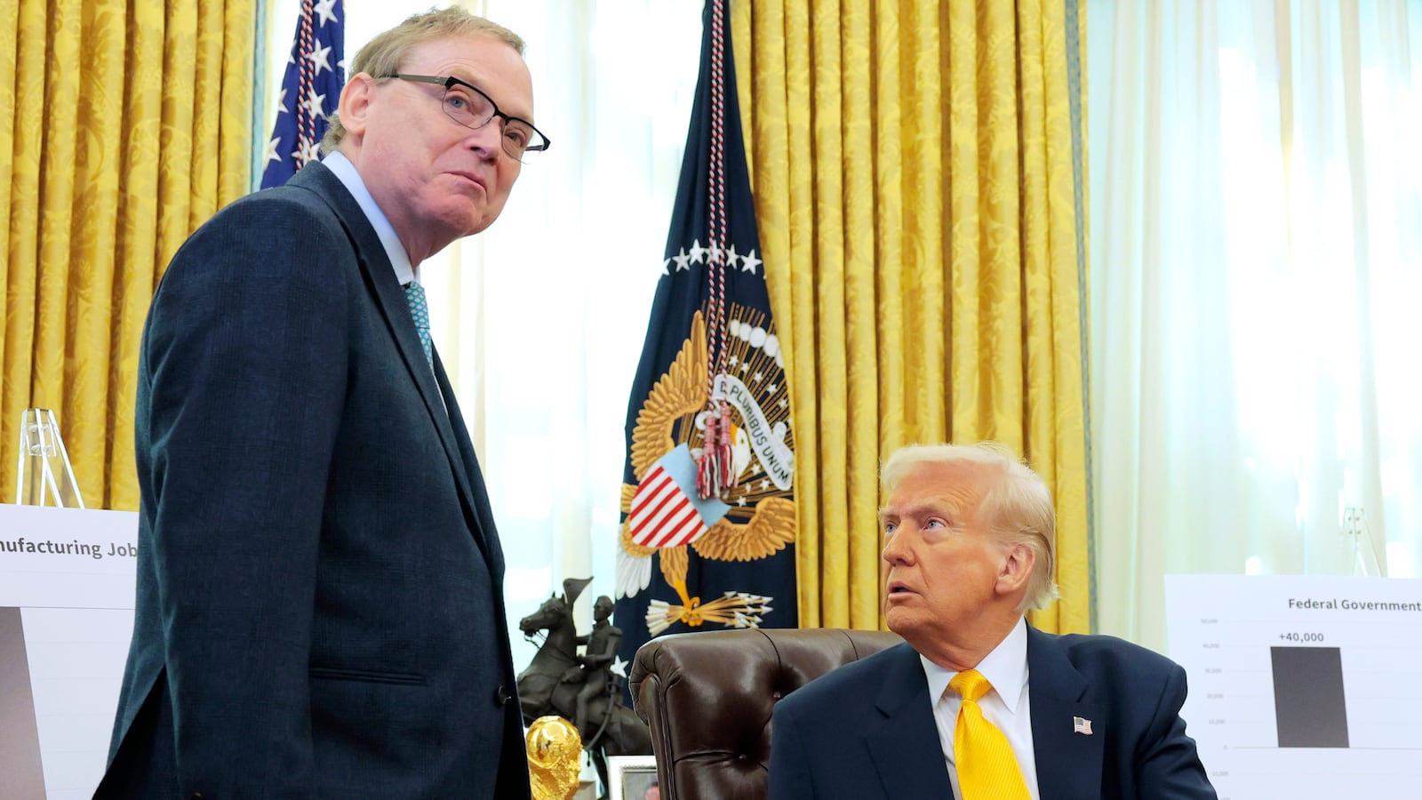 President Donald Trump speaks with Director of the National Economic Council Kevin Hassett in the Oval Office.