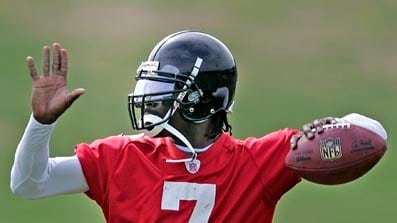 cheats/2009/07/27/vick-conditionally-reinstated-to-nfl/michael-vick-footbal_yffd5t