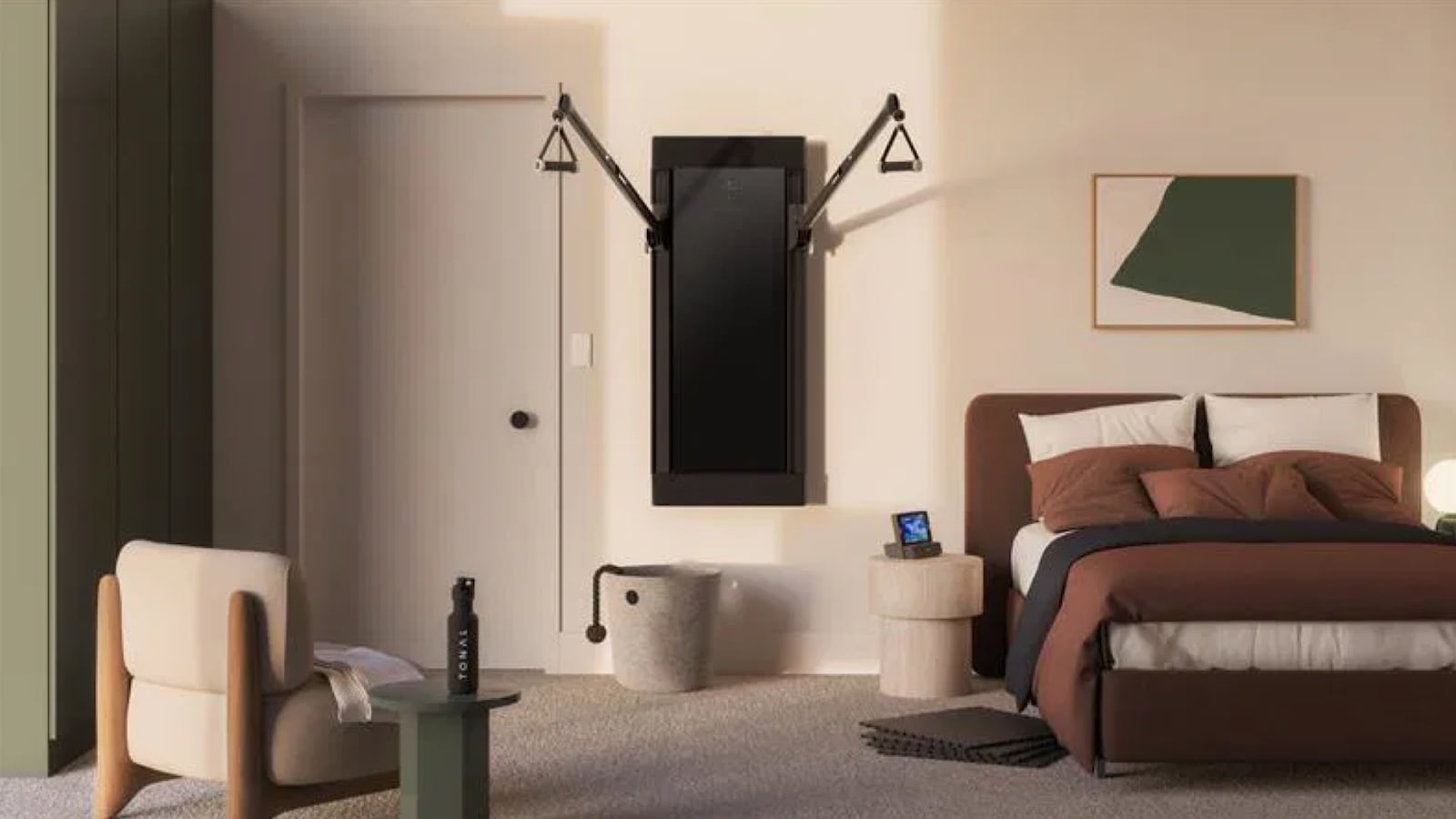 Tonal wall-mounted smart gym installed in a modern bedroom setup, with workout accessories on nearby furniture, neutral decor, and natural lighting highlighting the compact design.