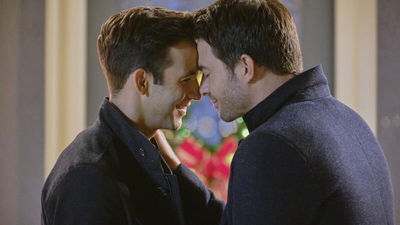 Jonathan Bennett (right) and Robert Buckley in “The Christmas House,” which featured the Hallmark Channel's first same-sex kiss.