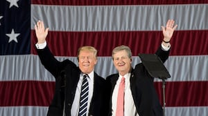 BATON ROUGE, LA - DECEMBER 9: President-elect Donald Trump and U.S. Senate candidate from Louisiana John Kennedy wave to the crowd at a rally at the Dow Chemical Hangar, December 9, 2016 in Baton Rouge, Louisiana. Trump is in Louisiana to campaign for Republican U.S. Senate candidate John Kennedy. (Photo by Drew Angerer/Getty Images)