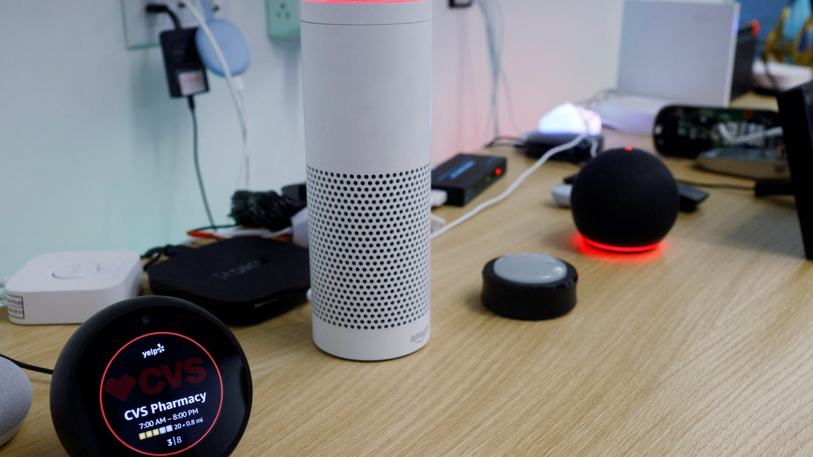 An Amazon Echo Spot, an Amazon Echo Plus 1st Generation, an Amazon Echo Button and an Amazon Echo Dot 4th Generation.