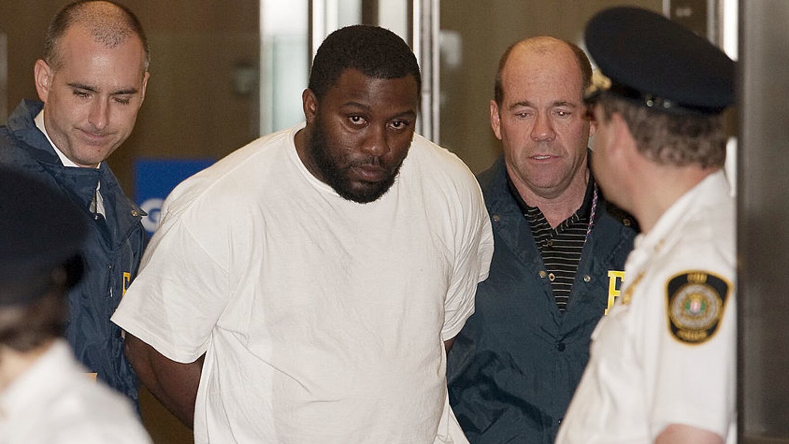 Onta Williams, one of the so-called “Newburgh Four,” is walked out of 27 Federal Plaza after a plot to bomb the Riverdale Jewish Center.