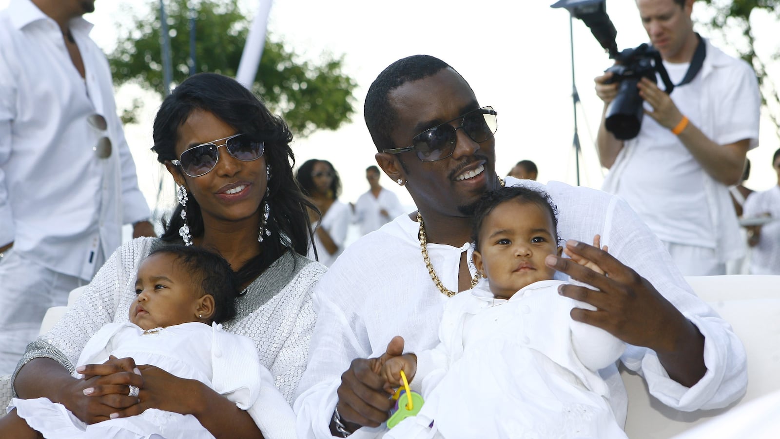 Sean “Diddy" Combs and Kim Porter with their twin daughters