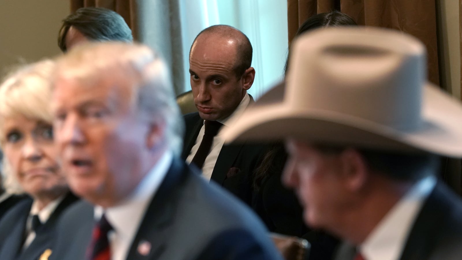 Senior Advisor to the President Stephen Miller looks on as U.S. President Donald Trump hosts a round-table discussion on border security and safe communities with State, local, and community leaders in the Cabinet Room of the White House on January 11, 2019 in Washington, DC.