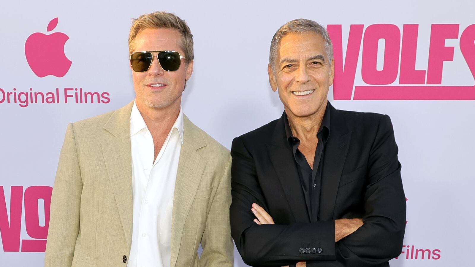 HOLLYWOOD, CALIFORNIA - SEPTEMBER 18: (L-R) Brad Pitt and George Clooney attend the premiere of the Los Angeles Premiere of the Apple Original Film "Wolfs" at TCL Chinese Theatre on September 18, 2024 in Hollywood, California.