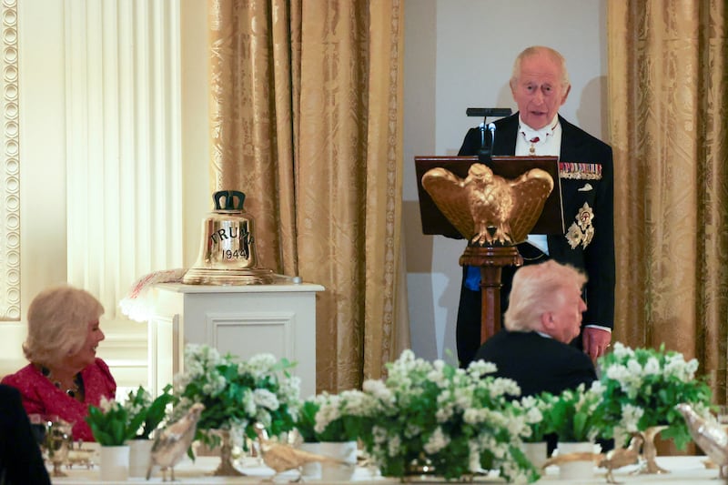 Britain's King Charles speaks as U.S. President Donald Trump and Britain's Queen Camilla listen during a state dinner for Britain's King Charles and Queen Camilla at the White House in Washington, D.C., U.S., April 28, 2026.
