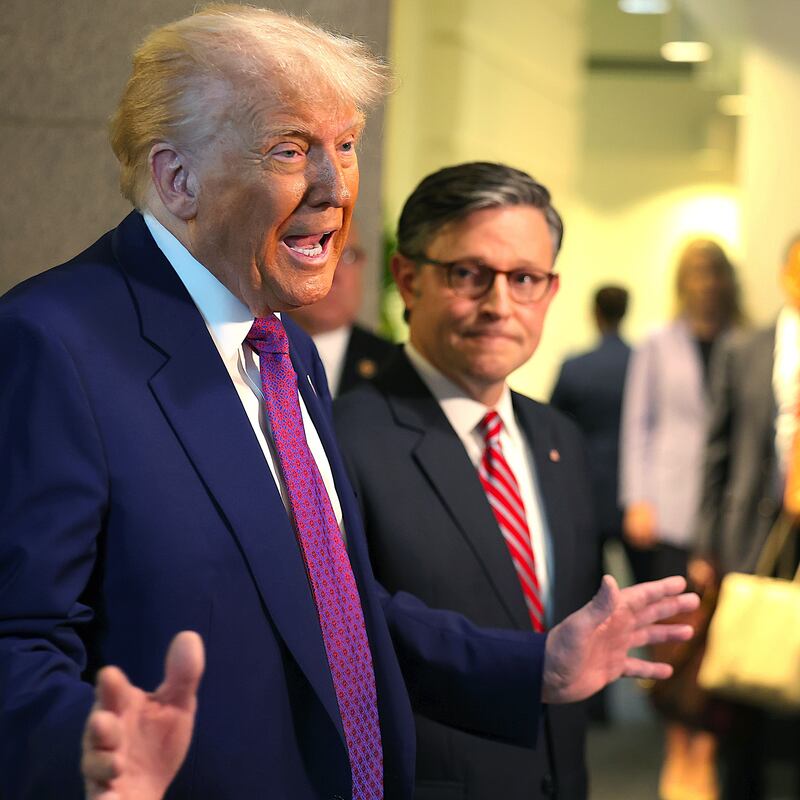 With Speaker of the House Mike Johnson (R-LA) by his side President Donald Trump speaks to the press.