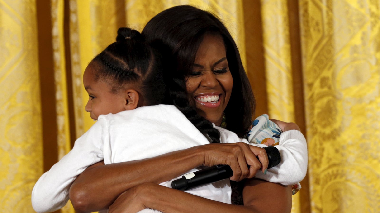 articles/2015/04/28/how-michelle-obama-became-hugger-in-chief/150427-shire-obama-tease_wzszmd
