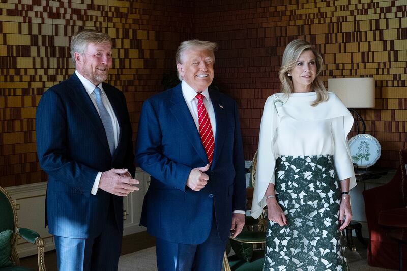 President Donald Trump poses with King Willem-Alexander of the Netherlands and Queen Maxima at Paleis Huis ten Bosch on the sidelines of the NATO Summit.