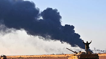 cheats/2011/03/22/gaddafi-attacks-civilians/libya-fighting_sltz5g