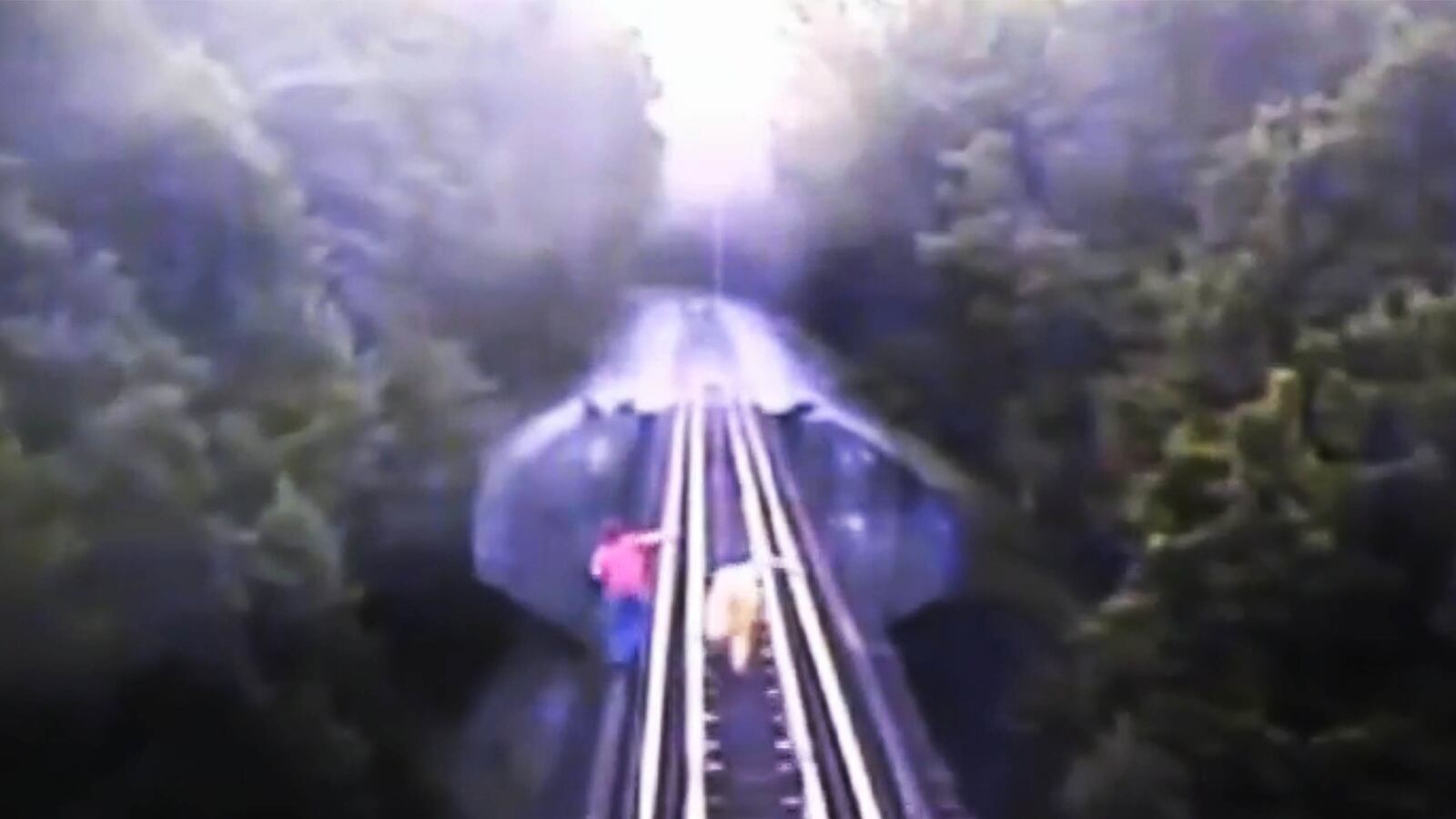 articles/2014/07/30/viral-video-of-the-day-women-survive-being-run-over-by-train/140730-viralvid-train-tease_xkbux0