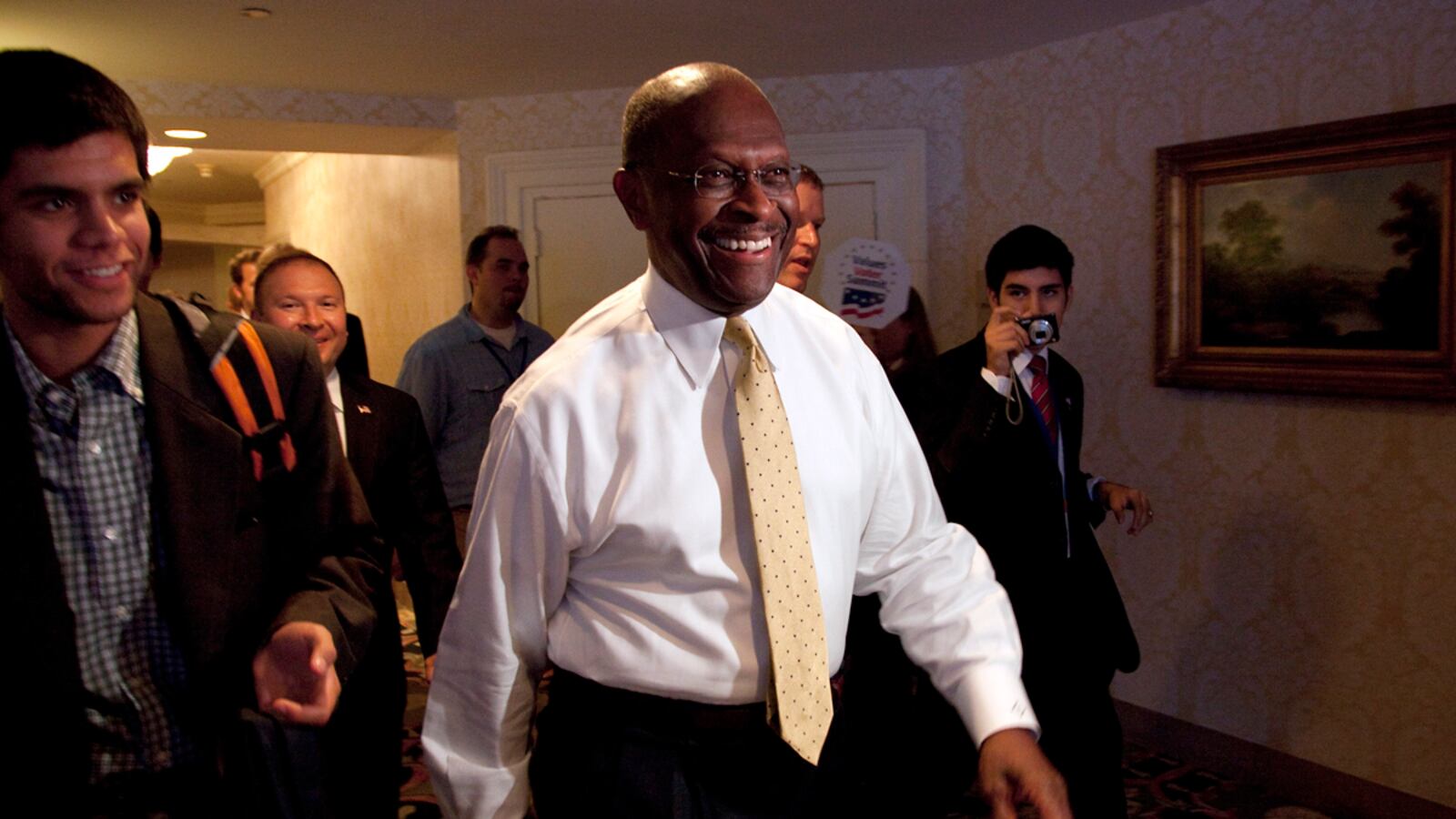 articles/2011/10/09/herman-cain-social-conservatives-new-darling-at-values-voter-summit/romney-cain-values-voters-goldberg_n8idud