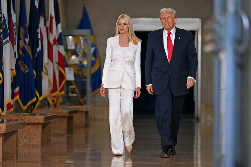 President Donald Trump and Attorney General Pam Bondi arrive to speak at the Department of Justice in Washington, D.C., on March 14, 2025.