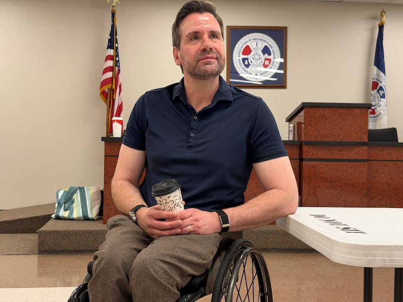 Josh Turek, the Democrat running for Iowa's open Senate sits after attending a roundtable discussion on healthcare in Des Moines, Iowa, U.S., June 22, 2026. Picture taken with a mobile phone. REUTERS/Nathan Layne