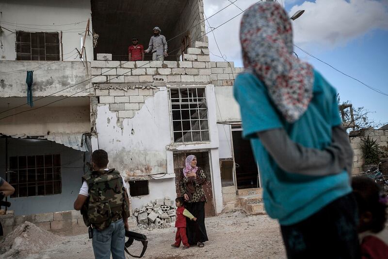 galleries/2013/10/09/the-last-ones-left-photos-of-a-syrian-family-that-refuse-to-leave-their-village/131007-syria-family8_vdonuf