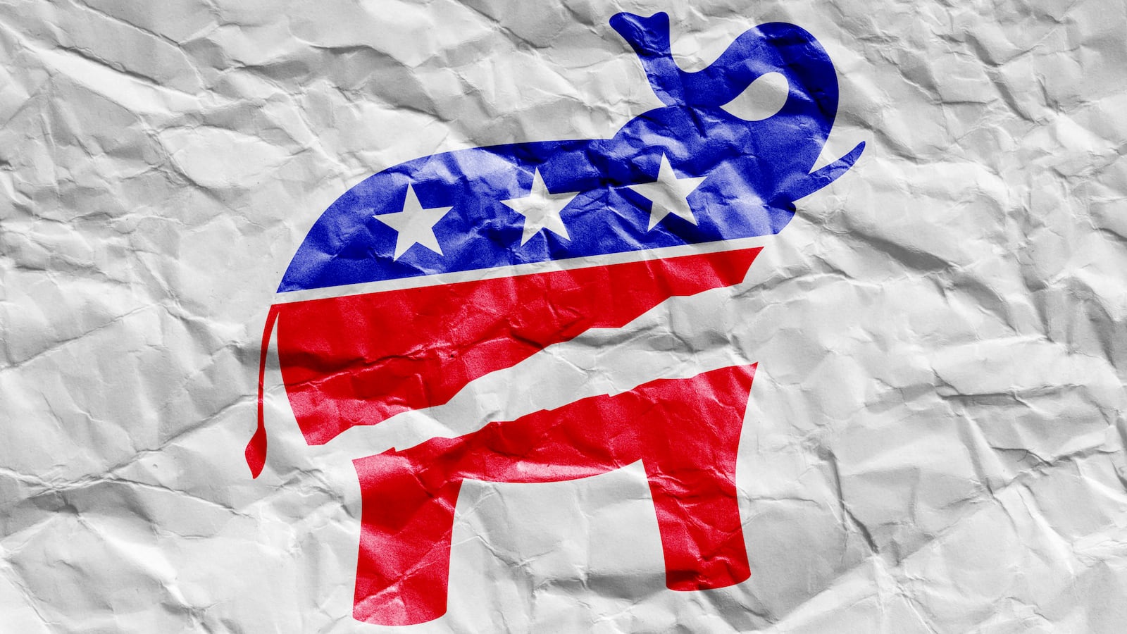 A photo illustration of the GOP Elephant torn in half on wrinkled paper.