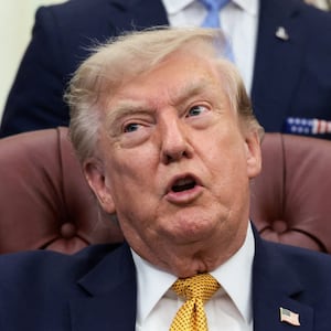 U.S. President Donald Trump points his finger as he answers questions from the media after signing an executive order establishing the President's Military Spouse Commission to be chaired by Jennifer Rauchet, wife of Secretary of Defense Pete Hegseth, in the Oval Office at the White House in Washington, D.C., U.S., August 3, 2026. REUTERS/Evelyn Hockstein