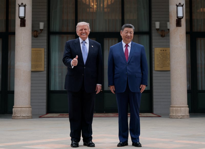 President Donald Trump poses for a picture with Chinese President Xi Jinping during a visit to the  Zhongnanhai Garden in Beijing, China, May 15, 2026.