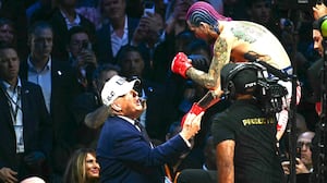 U.S. President Donald Trump speaks with America's Sean O'Malley after O'Malley defeated Canada's Aiemann Zahabi