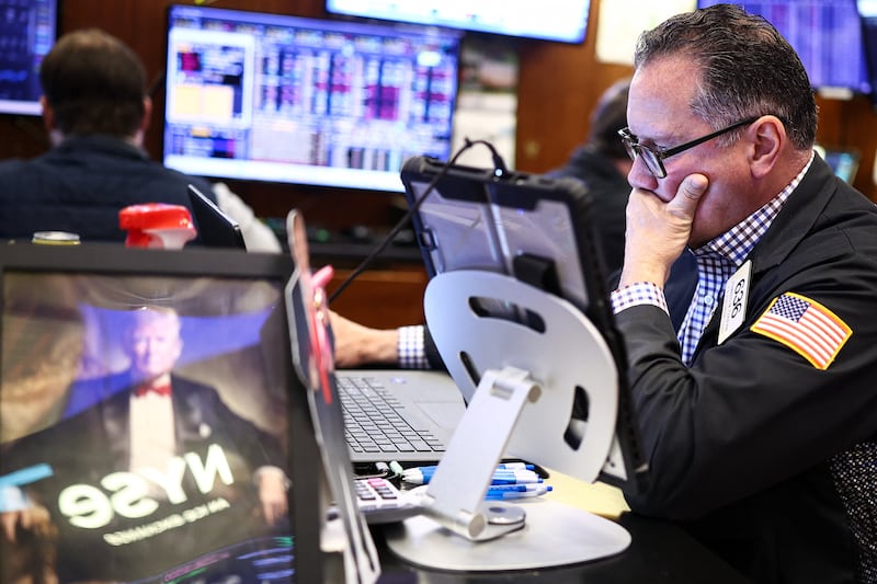 A trader works on the floor of the New York Stock Exchange at the opening bell in New York on April 2, 2026 as stocks tumbled early Thursday on the latest jump in oil prices after Trump's primetime address.