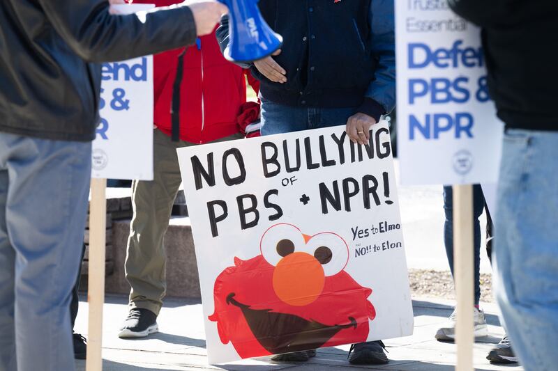 People participate in a rally to call on Congress to protect funding for US public broadcasters, Public Broadcasting Service (PBS) and National Public Radio (NPR), outside the NPR headquarters in Washington, DC, on March 26, 2025. President Donald Trump said on March 25 that he would "love" to cut funding for the US public broadcasters, which reportedly will be reviewed by Elon Musk's Department of Government Efficiency this week. (Photo by SAUL LOEB / AFP)
