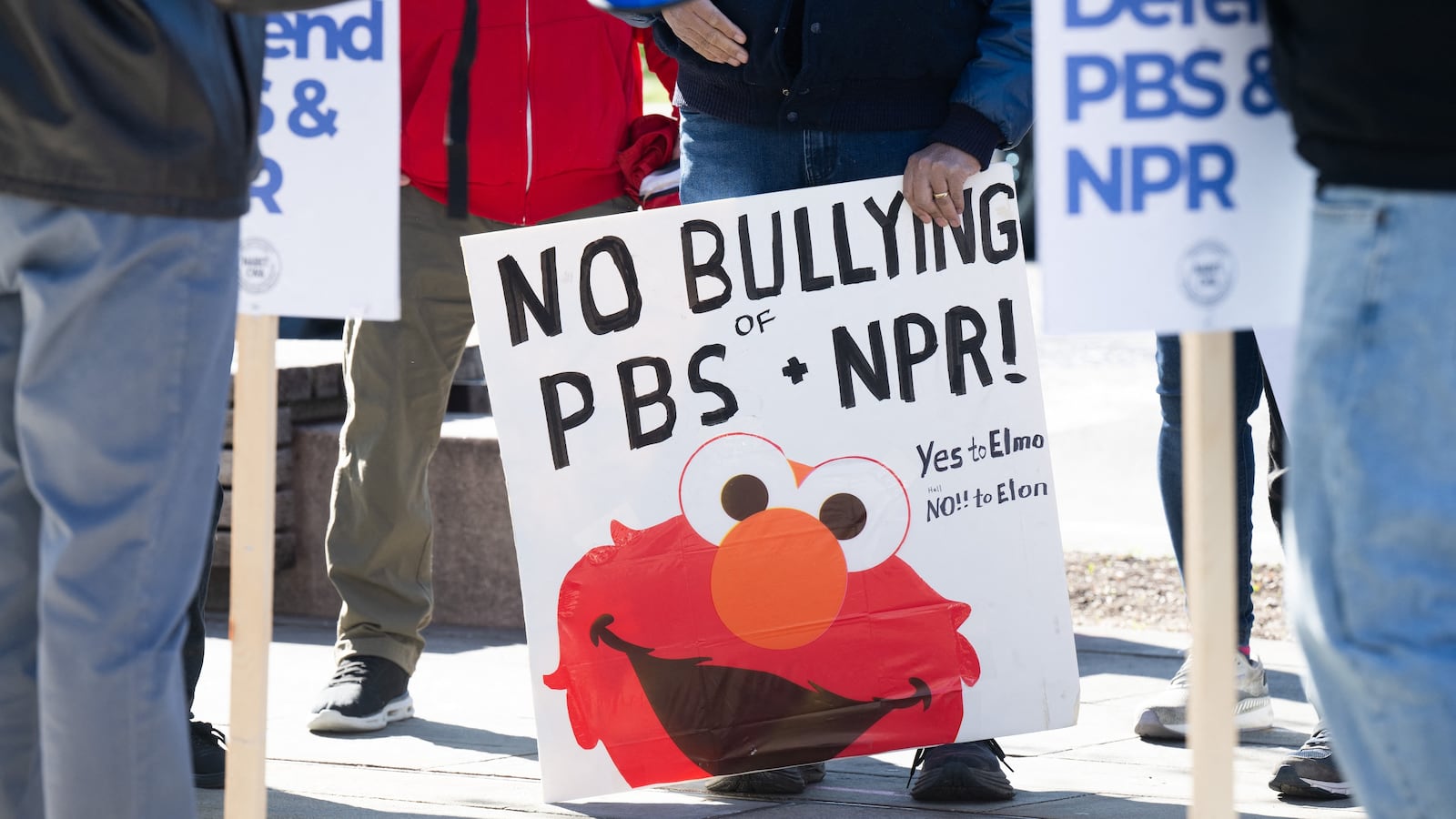 People participate in a rally to call on Congress to protect funding for US public broadcasters, Public Broadcasting Service (PBS) and National Public Radio (NPR), outside the NPR headquarters in Washington, DC, on March 26, 2025. President Donald Trump said on March 25 that he would "love" to cut funding for the US public broadcasters, which reportedly will be reviewed by Elon Musk's Department of Government Efficiency this week. (Photo by SAUL LOEB / AFP)