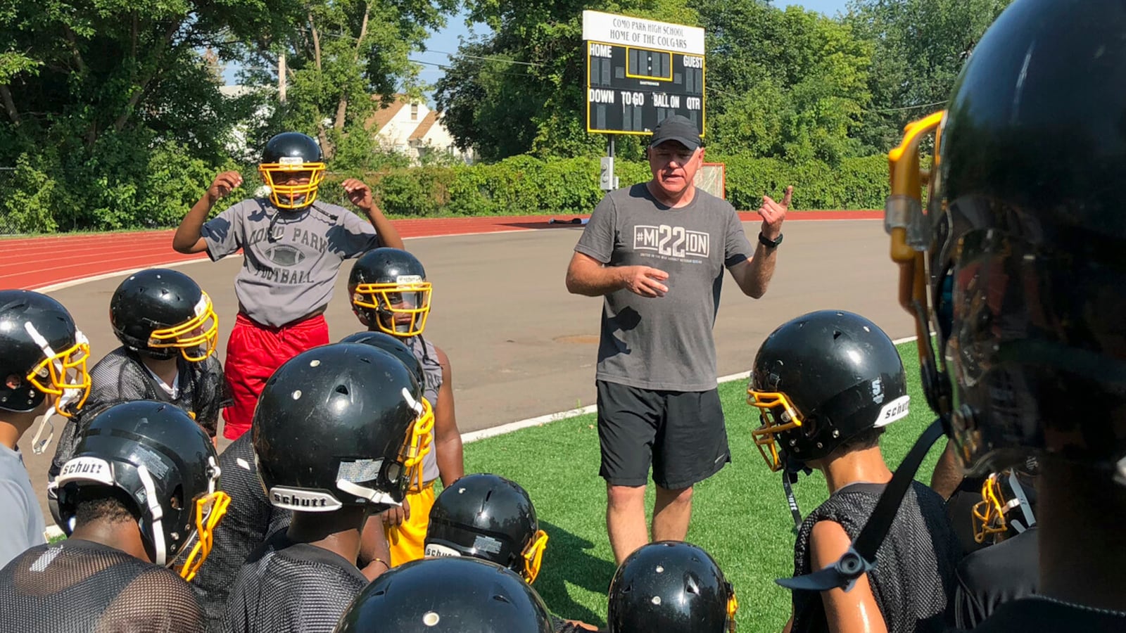 Tim Walz, then a candidate for Minnesota governor, gives a pep talk to football players at Como Park Senior High School in St. Paul in 2018.