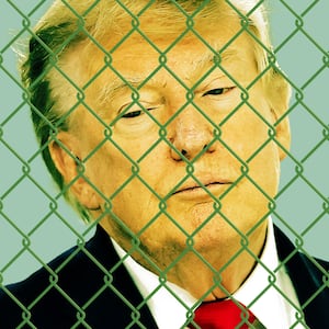 Donald Trump behind a fence.