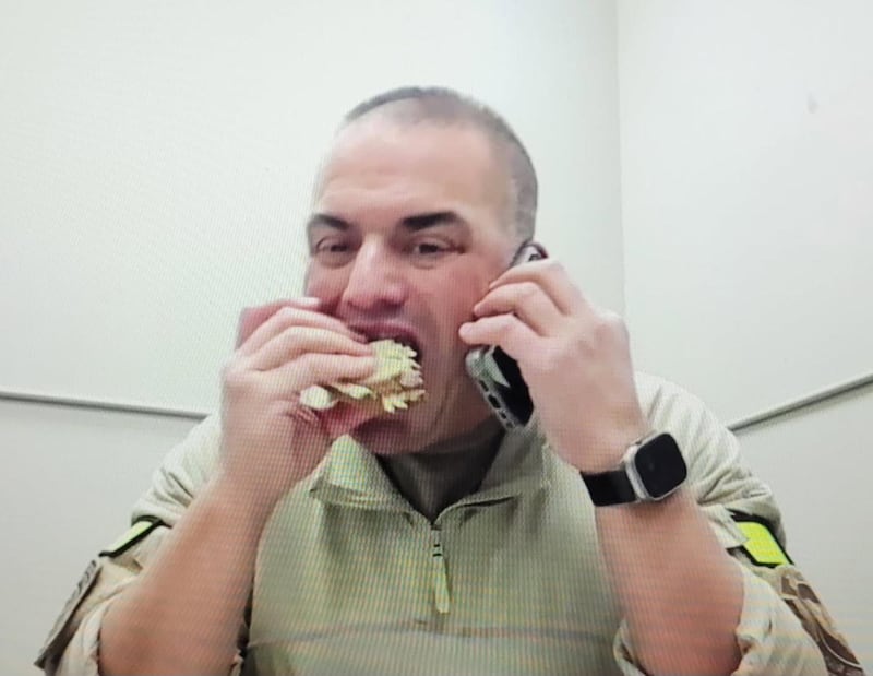 Dr. Alexander Eastman, eating on the job.