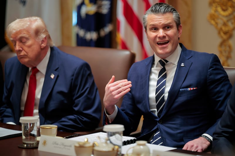 U.S. Secretary of War Pete Hegseth (R) speaks alongside U.S. President Donald Trump during a Cabinet meeting in the Cabinet Room of the White House on March 26, 2026 in Washington, DC.