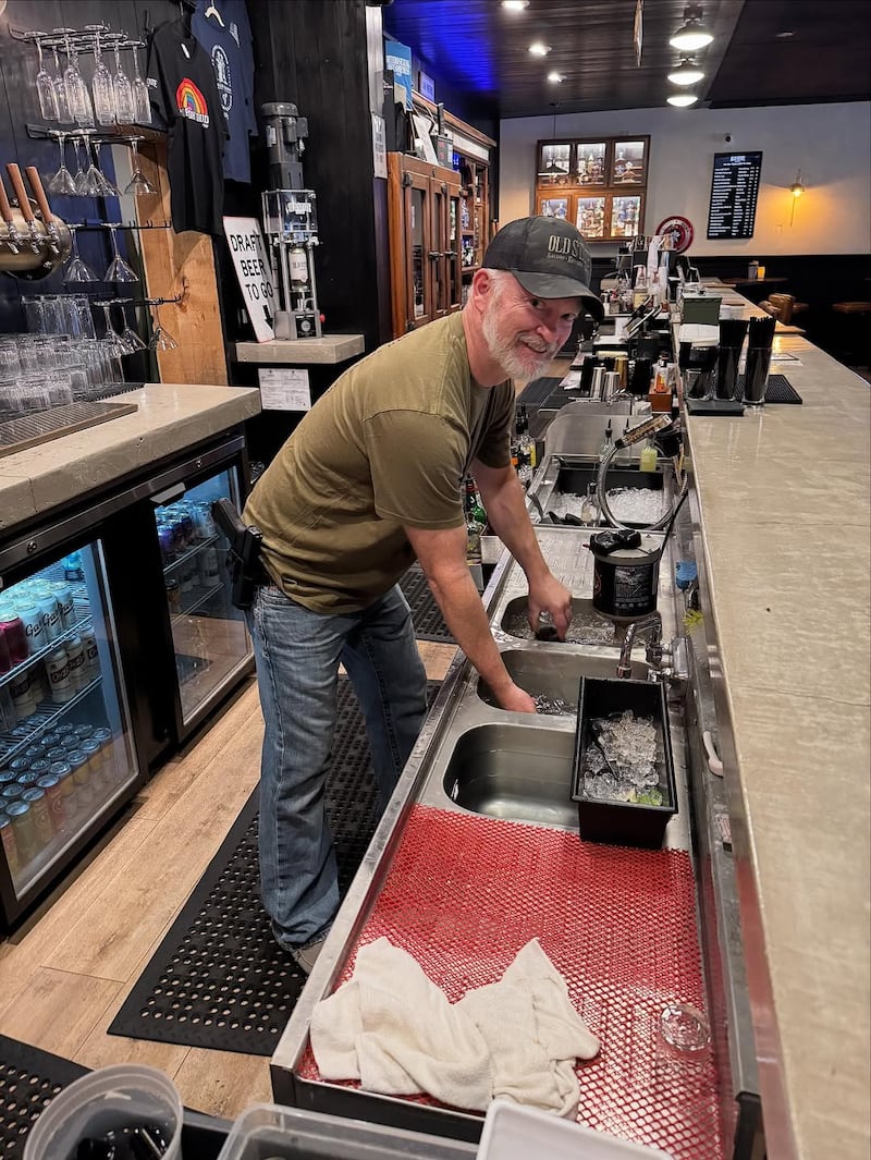 Owner of the Old State Saloon, Mark Fitzpatrick, and his gun.