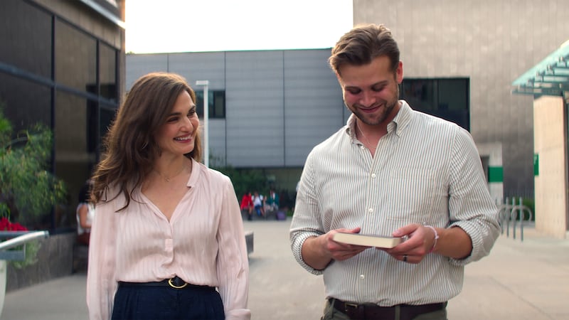 (L-R) Rachel Weisz as The Protagonist and Leo Woodall as Vladimir.