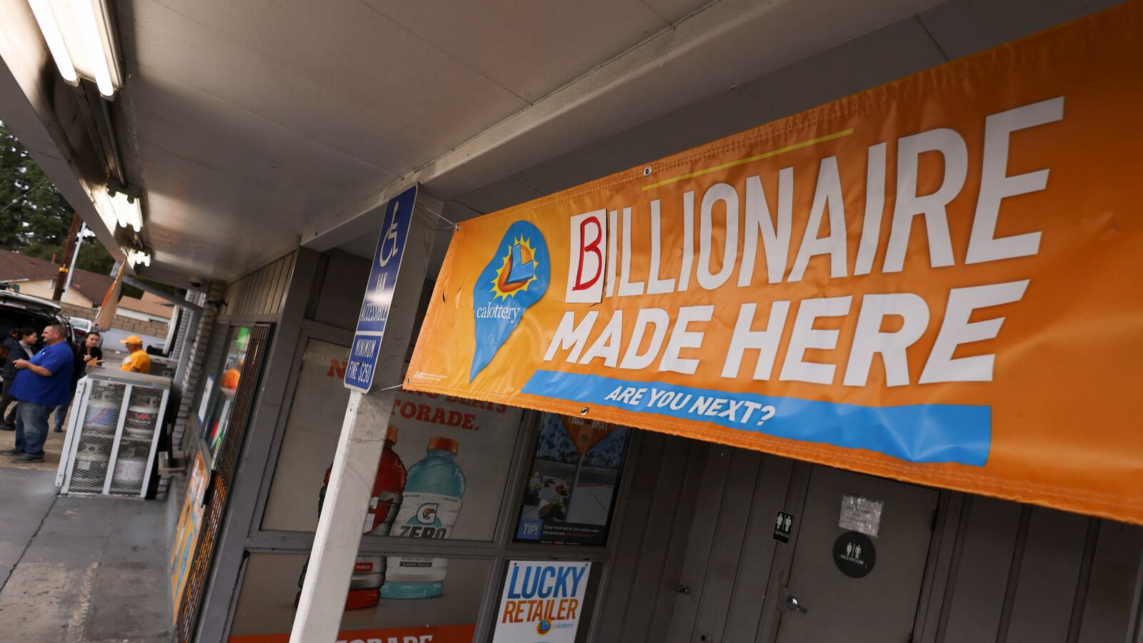 A banner is seen at Joe's Service Center, where a single winning ticket for the Powerball lottery drawing was sold,