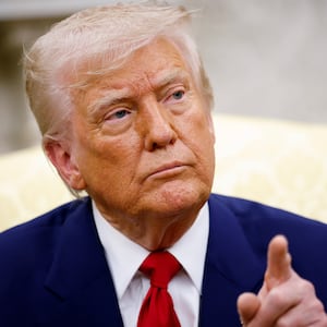 U.S. President Donald Trump takes a question from a member of the media.