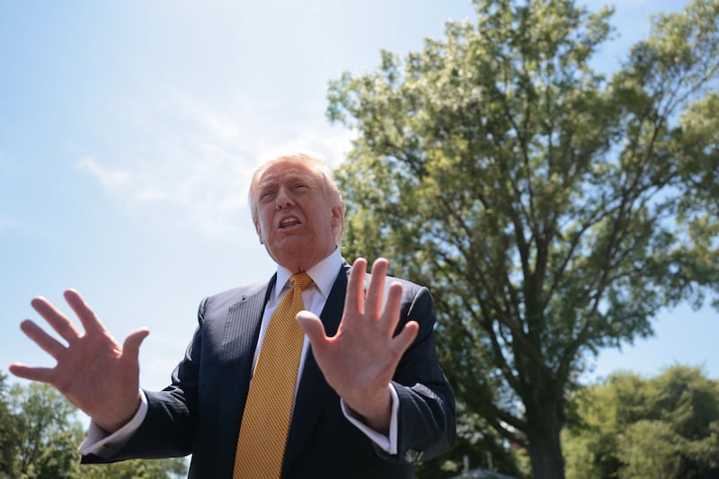 U.S. President Donald Trump speaks to the press, ahead of departing the White House for Joint Base Andrews en route to Beijing, China, in Washington, D.C., U.S., May 12, 2026.