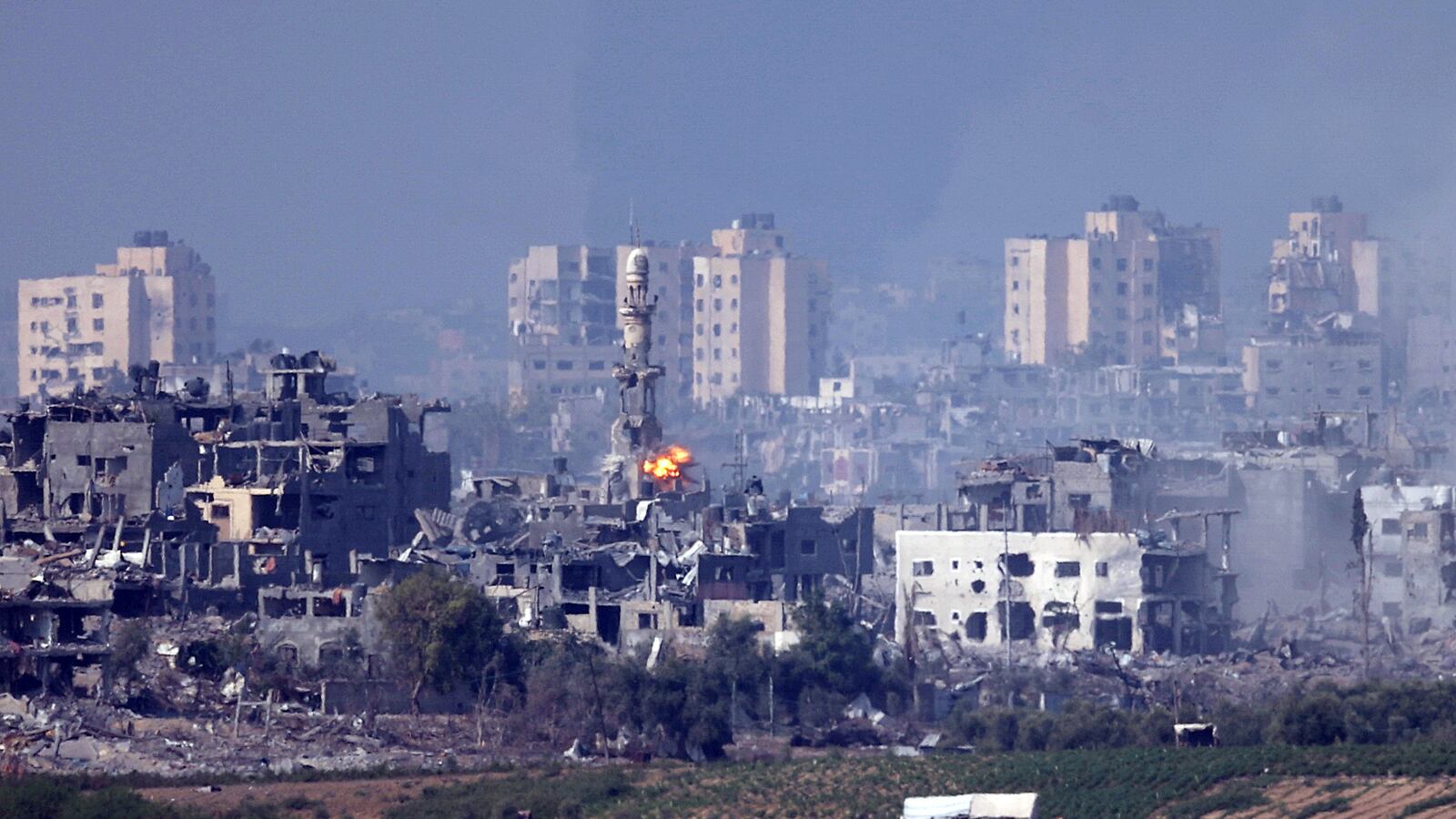 An Israeli missile strikes near a minaret in Gaza.