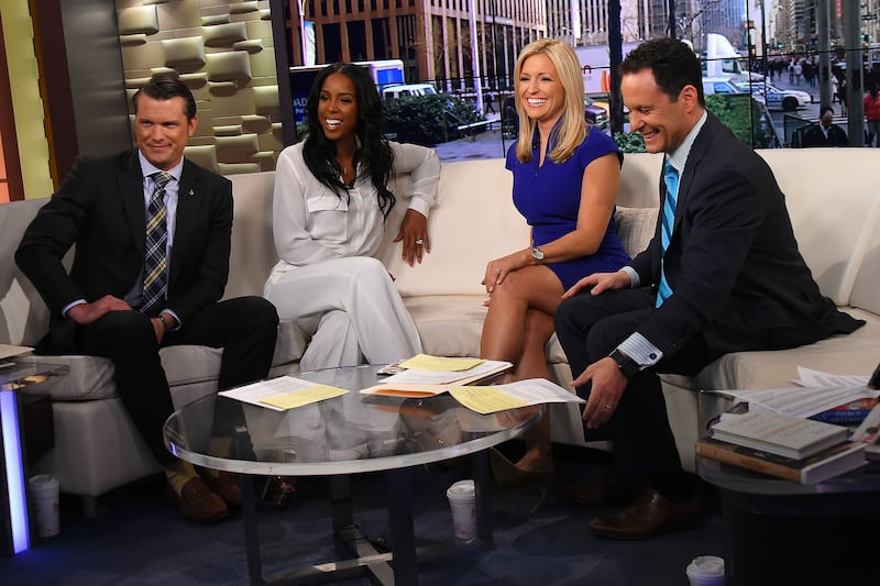 NEW YORK, NY - MARCH 21: Singer Kelly Rowland (2L) is interviewed by co-hosts (L-R) Pete Hegseth, Ainsley Earhardt and Brian Kilmeade during "Fox And Friends" at FOX Studios on March 21, 2016 in New York City. (Photo by Ben Gabbe/Getty Images)