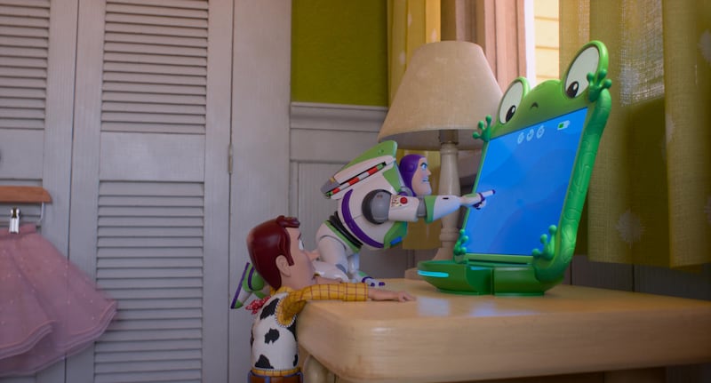 Woody, Buzz Lightyear, and Lilypad in Toy Story 5.