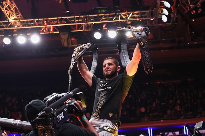 Islam Makhachev (blue gloves) acknowledges the crowd after defeating Jack Della Maddalena (not pictured) in the welterweight championship bout during UFC 322 at Madison Square Garden