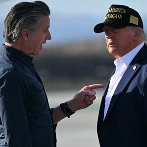 US President Donald Trump and First Lady Melania Trump are greeted by California Governor Gavin Newsom upon arrival at Los Angeles International Airport in Los Angeles, California, on January 24, 2025, to visit the region devastated by the Palisades and Eaton fires. (Photo by Mandel NGAN / AFP) (Photo by MANDEL NGAN/AFP via Getty Images)