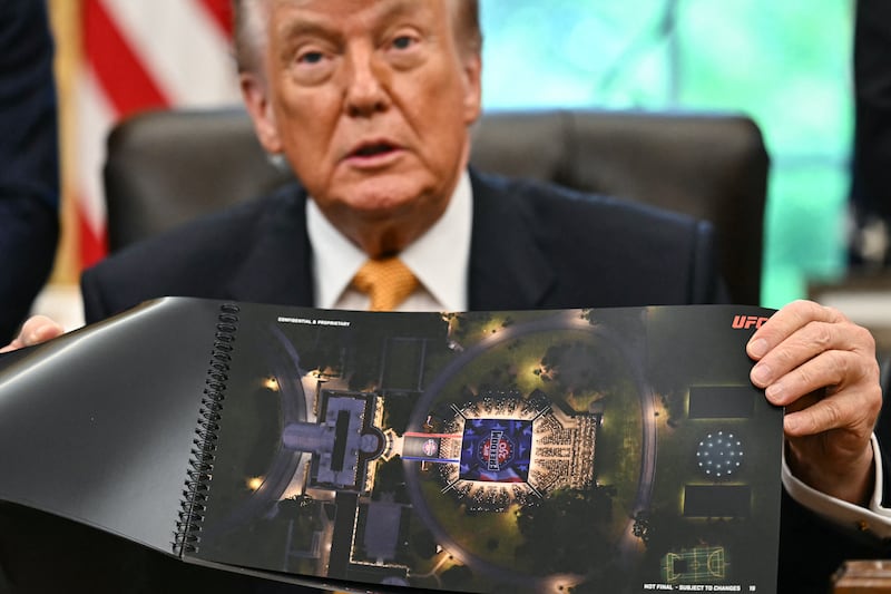 US President Donald Trump shows a rendering of the upcoming "UFC Freedom 250" event