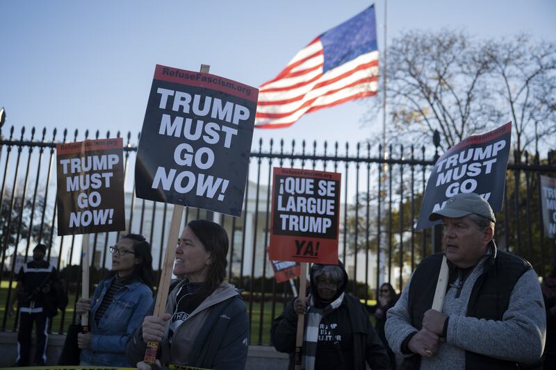 WASHINGTON DC, UNITED STATES - NOVEMBER 17: Demonstrators hold a protest outside the White House against U.S. President Donald Trump in Washington, DC, on November 17, 2025. (Photo by Celal Güne/Anadolu via Getty Images)