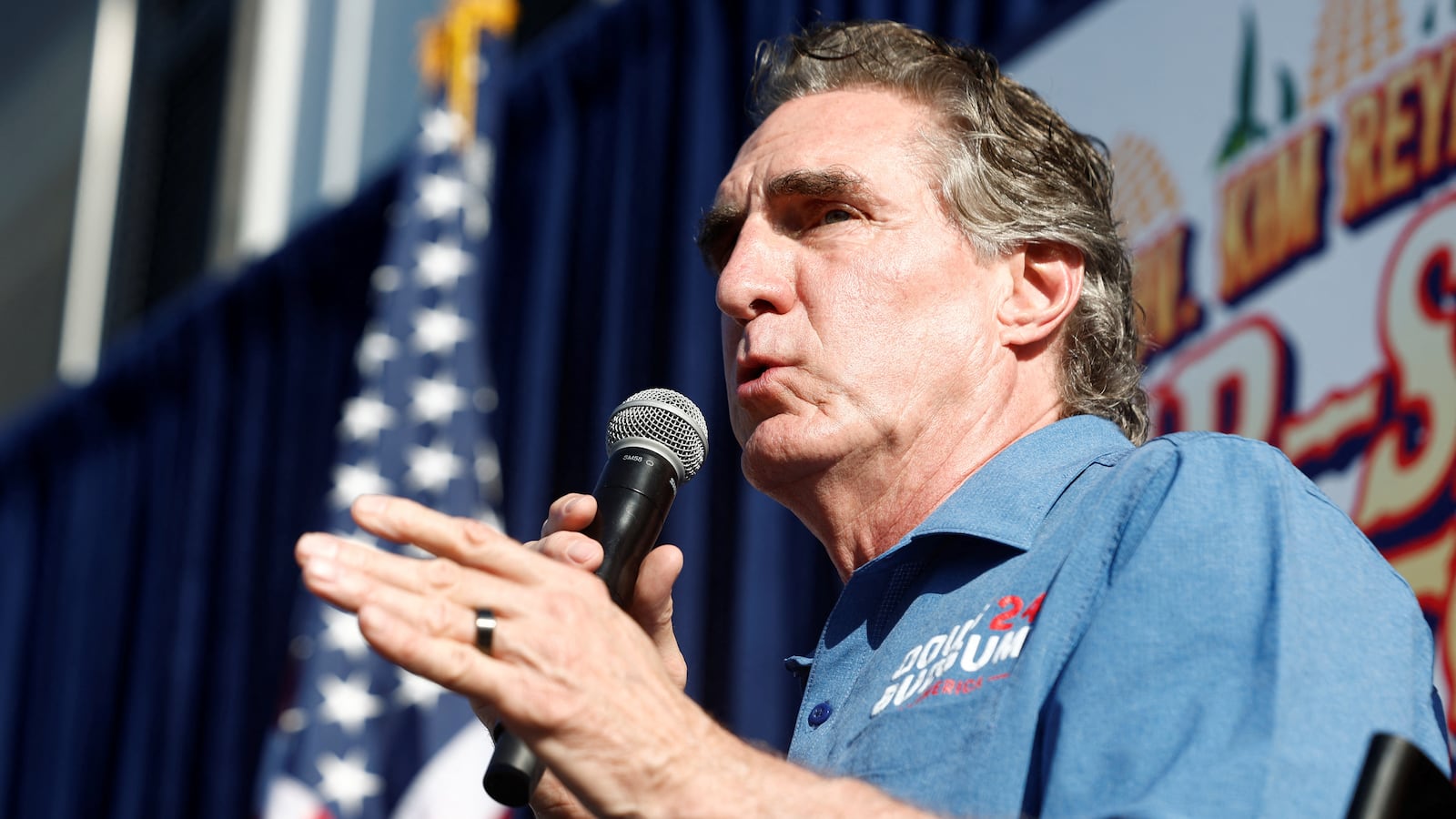 "Republican U.S. presidential candidate and North Dakota Governor Doug Burgum speaks during Fair-Side Chat with Governor of Iowa Kim Reynolds.