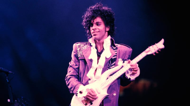 Prince performing on stage - Purple Rain Tour.