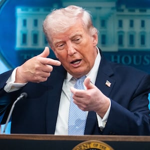 President Donald Trump mimics firing a gun during a news conference in the White House briefing room about the war in Iran on Monday, April 6, 2026.