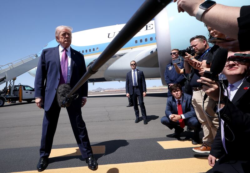 PHOENIX, ARIZONA - APRIL 17: U.S. President Donald Trump speaks to members of the media as he arrives at Sky Harbor International Airport April 17, 2026 in Phoenix, Arizona. Trump is scheduled to speak at a Turning Point USA event titled “Build the Red Wall”, intended to turn out young voters for the midterm elections. (Photo by Win McNamee/Getty Images)