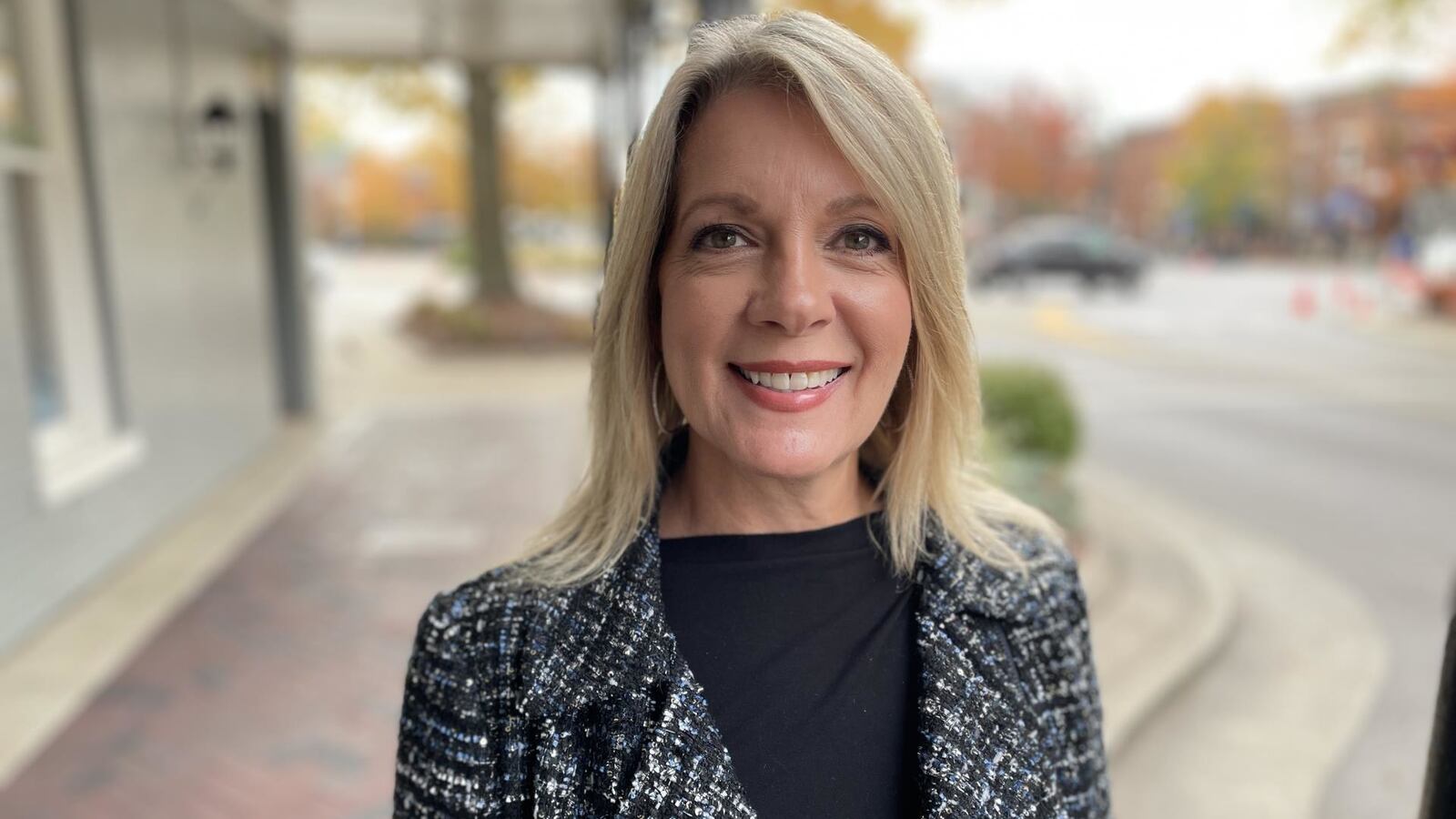 Headshot of Gabrielle Hanson smiling and staring forward.
