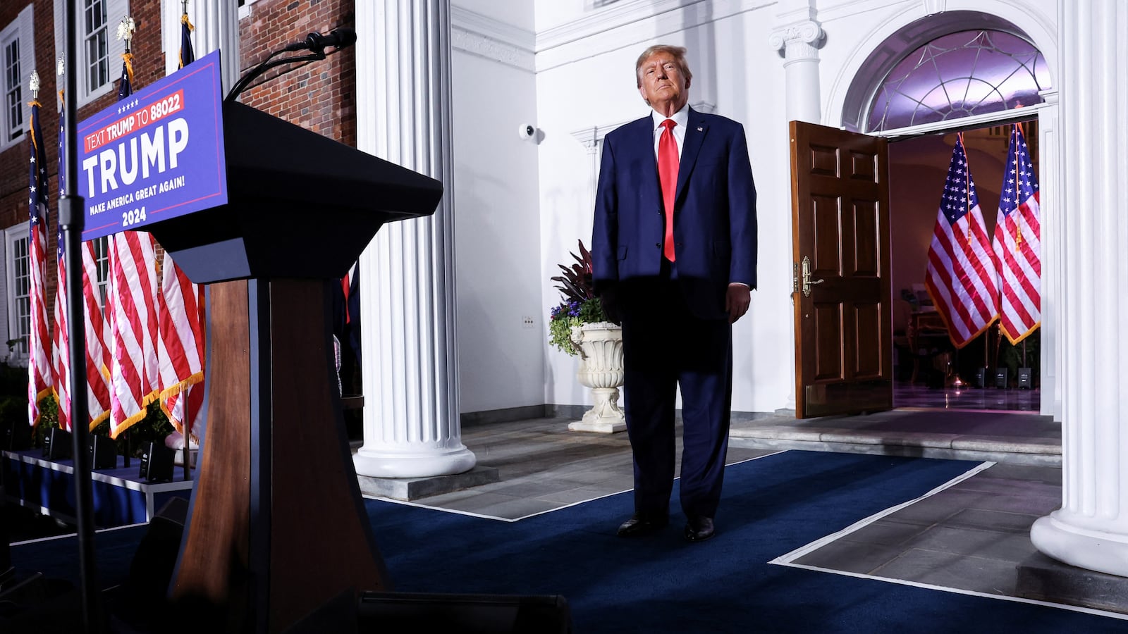 Former U.S. President Donald Trump walks onstage during an event following his arraignment on classified document charges